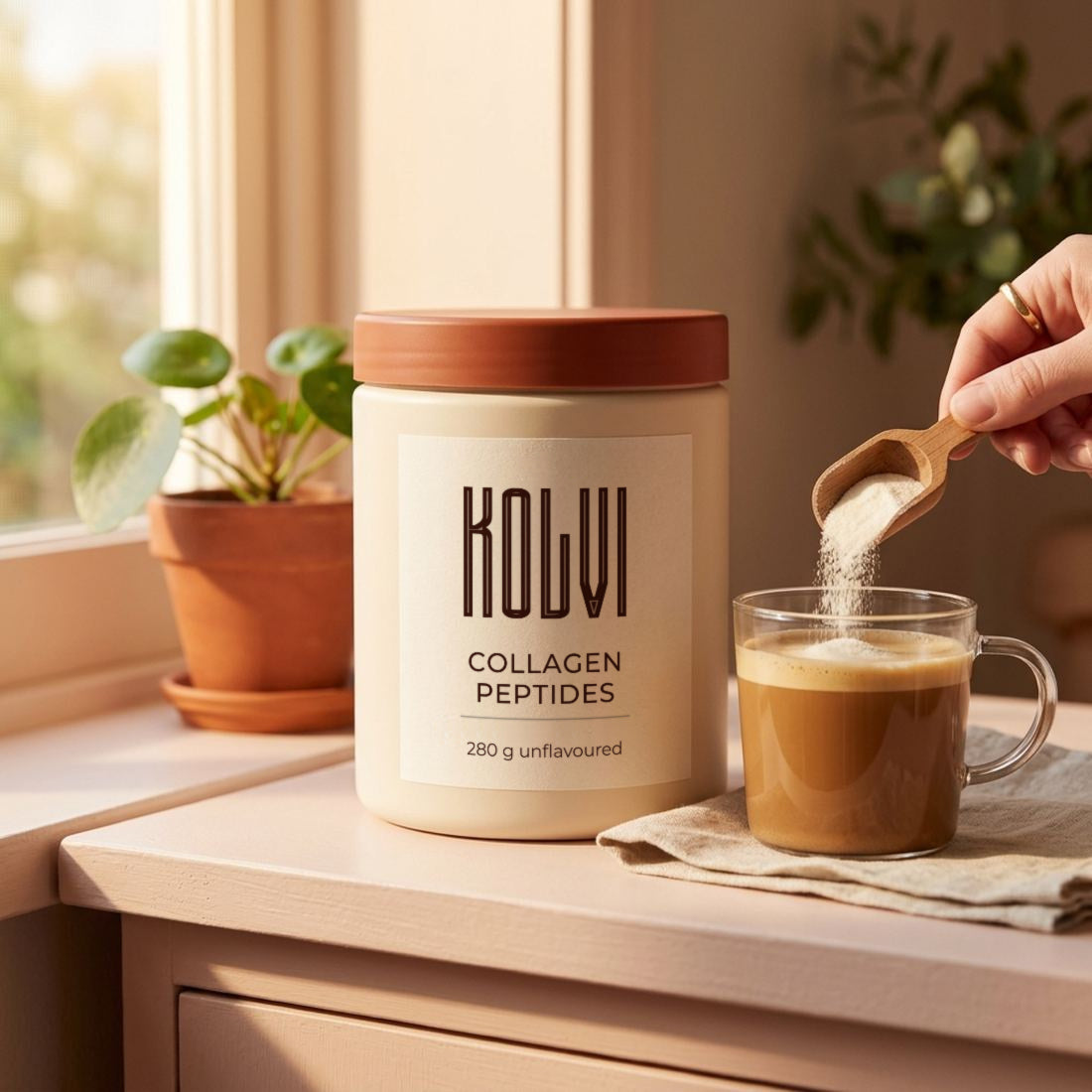 A scoop of Kolvi collagen going into a morning coffee by the window